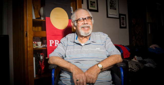 Lester Bostock sitting in a chair in his home. 
