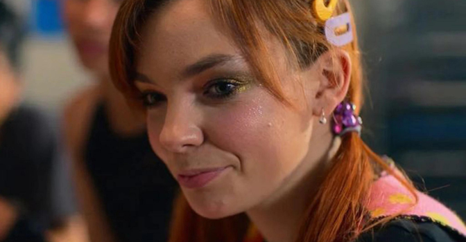Chloe Hayden in heartbreak high, turned to the side with glitter on her face.